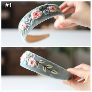 May include: A light blue velvet headband with embroidered flowers in pink, blue, and green.