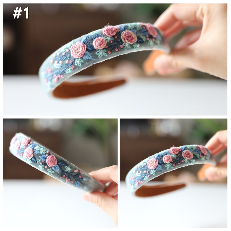 May include: A light blue headband with pink and green embroidered flowers.