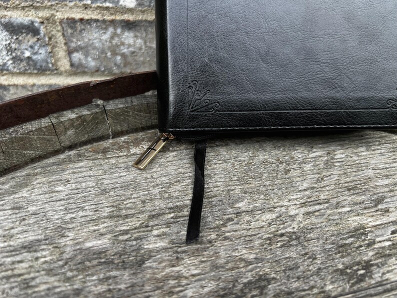 Gold zipper with cross and black satin ribbon marker