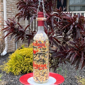 Cardinal Bird feeder made from a wine bottle - When a cardinal appears in your yard, it&#39;s a visitor from heaven.