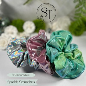 May include: Three iridescent scrunchies in silver, pink, and green. 9 Colors available. Sparkle Scrunchies.