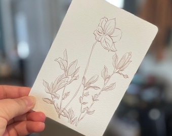 May include: A line drawing of a flower with leaves on a white background. The drawing is done in a brown ink.
