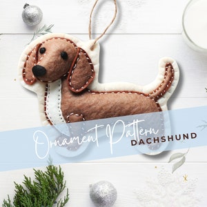 Może przedstawiać: Wz&oacute;r ozdoby filcowej w kształcie szczeniaka rasy dachshund. Wz&oacute;r jest dla brązowego szczeniaka rasy dachshund z białymi akcentami. Wz&oacute;r znajduje się na białym tle z niebieskim banerem, na kt&oacute;rym widnieje napis "Wz&oacute;r ozdoby szczeniaka rasy dachshund".