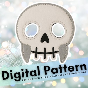 May include: A light gray skull-shaped felt applique with black details, including eye sockets, nose, and teeth. The design is stitched with a contrasting thread. The words "Digital Pattern" are displayed on a blue banner.