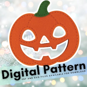 May include: Orange felt pumpkin with a green stem and white stitched details. The pumpkin has cut-out eyes, nose, and mouth. The words "Digital Pattern" are displayed in black text, with additional text below.