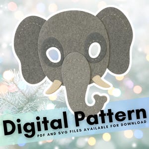 Puede incluir: Una máscara de elefante de fieltro gris con aberturas blancas para los ojos y colmillos de marfil. La máscara tiene detalles cosidos. El texto en una pancarta dice "Digital Pattern".