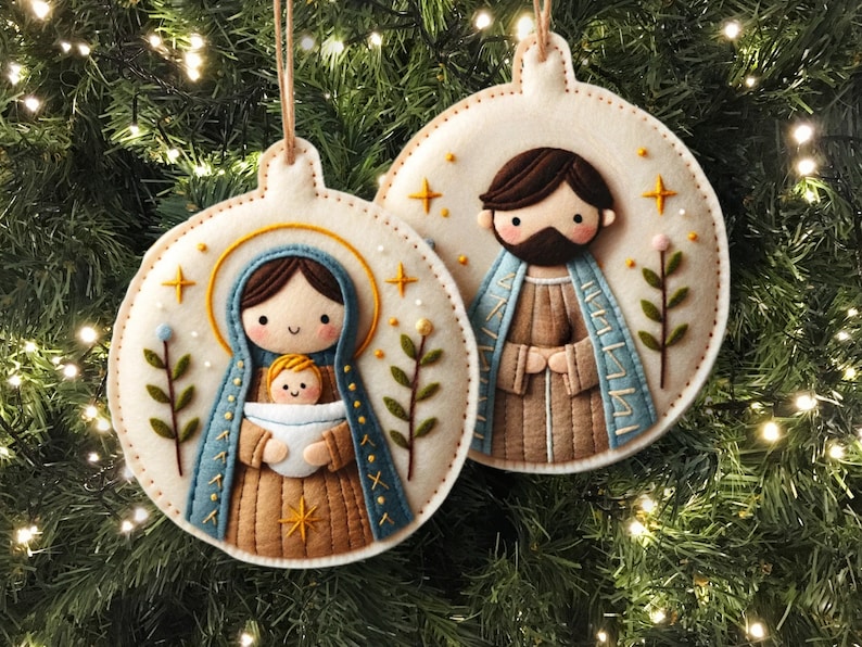 May include: Two felt Christmas ornaments depicting the Holy Family. The ornament on the left features Mary holding baby Jesus, while the ornament on the right features Joseph. Both ornaments are decorated with stars, leaves, and a white background.