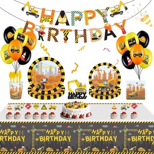 May include: A construction-themed birthday party set with balloons, plates, cups, and a banner that reads "Happy Birthday." The decorations feature yellow and black construction vehicles and safety cones. A cake and cupcakes are also included.