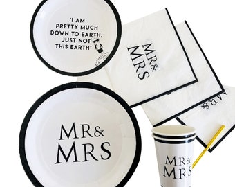 May include: Black and white paper plates and cups with the text "MR & MRS" and a quote about being down to earth.  The napkins also have the text "MR & MRS" printed on them.