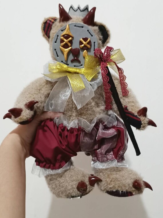 stuffed animals with clay faces