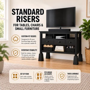May include: A set of four black furniture risers designed for tables, chairs, and small furniture. The risers are thick, durable, and feature reinforced walls to provide stable support for various leg shapes including square, round, and rectangular.