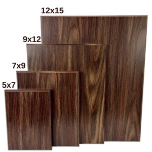May include: Five wooden plaques in various sizes, ranging from 5x7 inches to 12x15 inches. The plaques are all made of a dark brown wood with a natural grain pattern.