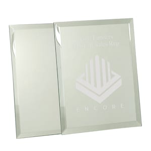 May include: A glass plaque with a beveled edge and an etched design. The plaque features the text "Tom Landers Q2 Top Sales Rep" and a logo with the word "ENCORE".