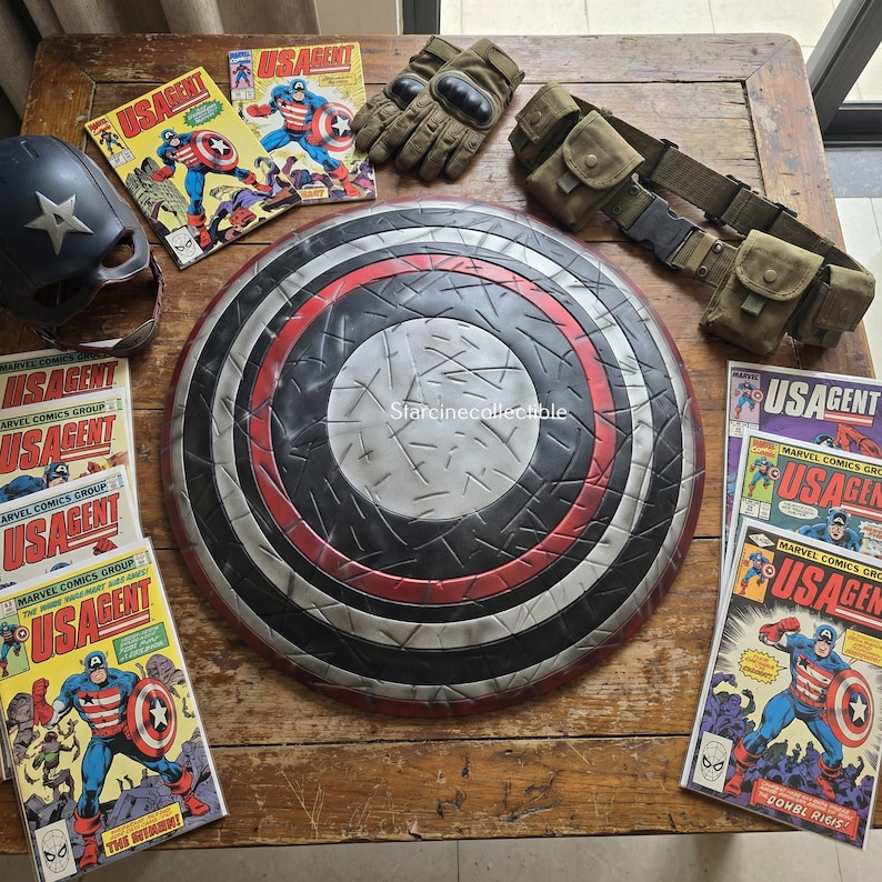 May include: A collection of US Agent comic books, a shield with red, black, and silver concentric circles, a helmet, gloves, and a utility belt. The shield has a textured surface. The comic books feature the US Agent character.