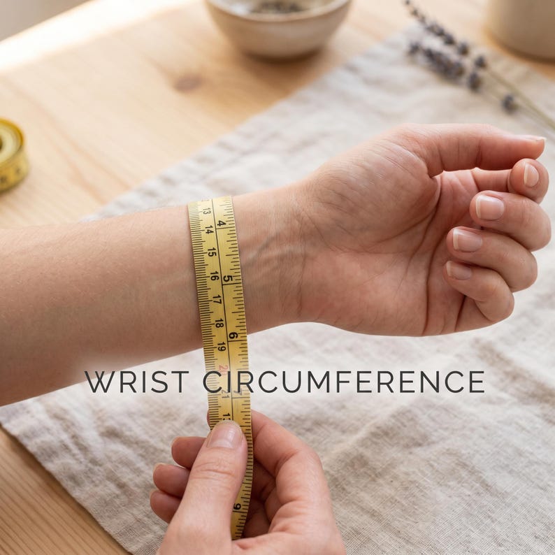 May include: A yellow measuring tape is wrapped around a wrist to measure circumference. The text "WRIST CIRCUMFERENCE" is printed in white on the image. The tape shows measurements in inches.