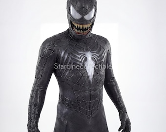 May include: A black Venom costume with a detailed texture and a white spider emblem on the chest. The mask features large white eyes and a menacing grin with sharp teeth. The costume is form-fitting.