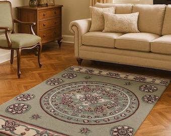 Handgetuft traditioneel wollen vloerkleed met medaillonmotief, vintage bloemenprint woonkamerkleed, saliegroen oosters design voor een tijdloze huisinrichting.