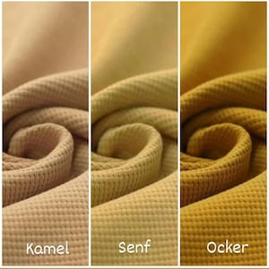 May include: Three fabric swatches in different shades of brown. The swatches are labeled "Kamel", "Senf", and "Ocker".