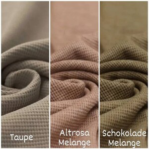 May include: Three fabric swatches in different shades of brown. The swatches are a waffle knit texture. The swatches are labeled "Taupe", "Altroasa Melange", and "Schokolade Melange".