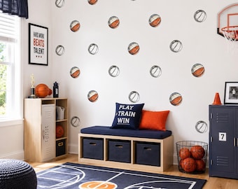 May include: A set of basketball-themed wall decals featuring multiple illustrations of basketballs in orange and black, designed to be applied to a wall surface to create a sports-themed decorative pattern for a room interior.