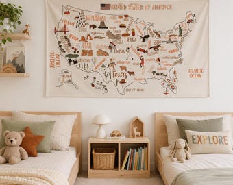 May include: A rectangular wall tapestry featuring a map of the United States of America with illustrations of regional landmarks and icons. The map is printed in muted earth tones on a cream-colored fabric background with the text United States of America.