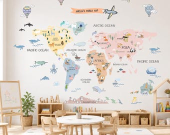 May include: A wall decal featuring a world map titled AMELIA'S WORLD MAP, displaying continents in pastel colors with illustrations of animals, hot air balloons, and sea creatures. The map includes labels for oceans and continents in black text.