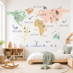 May include: A wall decal featuring a world map with pastel-coloured continents, labelled oceans, and various animal illustrations. The map includes text labels for continents like North America, South America, Europe, Asia, Africa, and Australia, along with oceans.