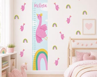 May include: A wall decal growth chart featuring a light blue background, a large pink swan wearing a gold crown, a colorful rainbow, and the name Melissa printed in pink. The chart includes imperial measurements from 10 to 60 inches.