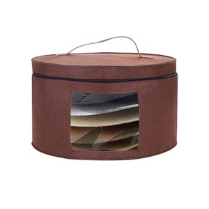 May include: A brown felt hat storage bag with a zipper closure and a clear window to view the hats inside. The bag has a handle for carrying.