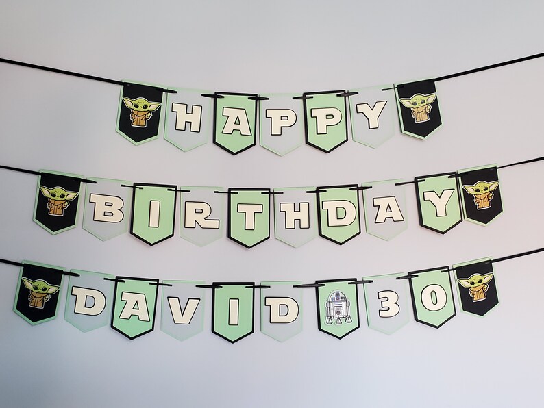 May include: A green and white banner with black string, featuring the words "Happy Birthday David 30". The banner has images of a cartoon character, a robot, and a star.