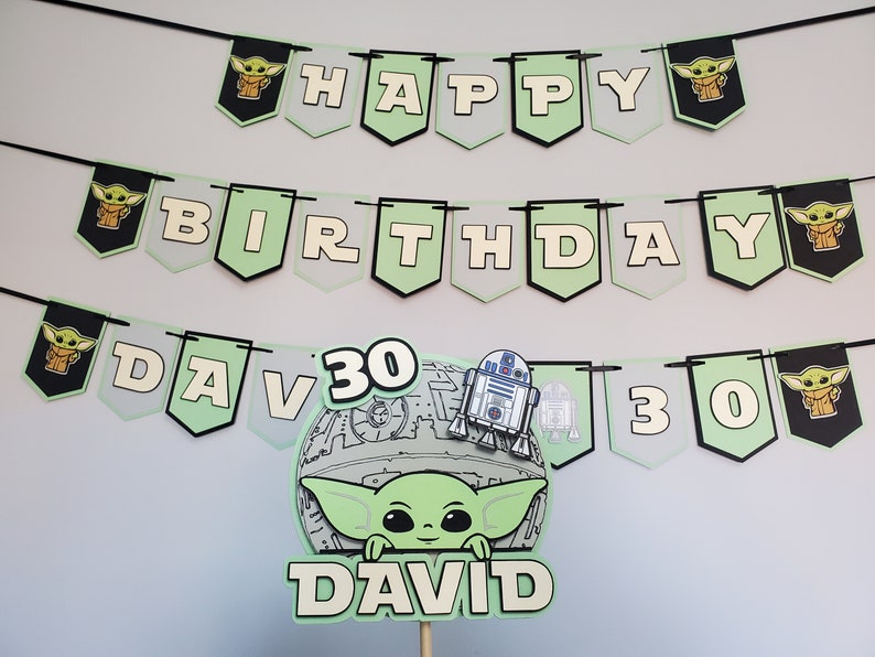 May include: Green and white banner with the words "Happy Birthday David 30" and images of a cartoon character. The banner is decorated with black and white images of a cartoon character.