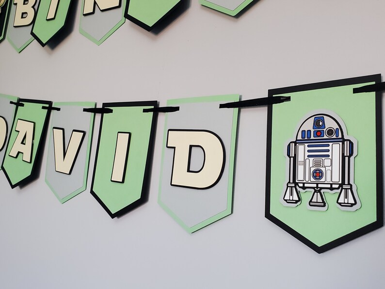 May include: Green and grey banner with the name "DAVID" and a cartoon image of R2-D2 from Star Wars.