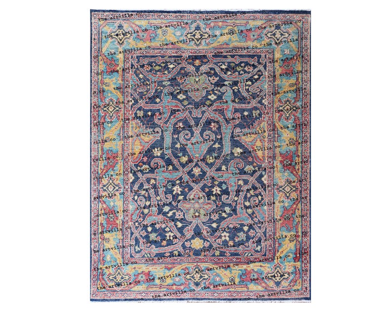May include: A blue, red, and yellow patterned rug with a floral design. The rug has a border with a repeating pattern of stars and diamonds.