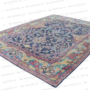 May include: A blue, red, and yellow patterned rug with a floral design. The rug has a traditional Persian style.