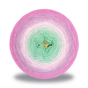 May include: A round ball of yarn with a gradient color scheme, transitioning from pink to green. A gold-colored heart-shaped charm is attached to the center. The yarn is likely for knitting or crochet projects.
