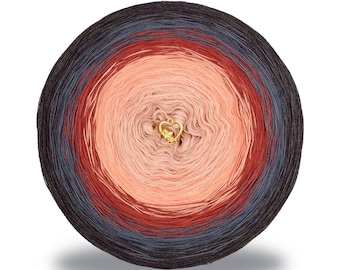 May include: A round ball of yarn with a gradient color scheme, transitioning from dark gray to coral and light peach in the center. A small gold heart charm is in the center. Ideal for knitting and crochet projects.