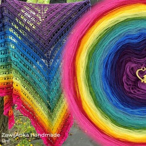 May include: A triangular crochet shawl featuring a vibrant rainbow gradient pattern with openwork lace details. Beside it sits a matching circular skein of rainbow yarn with a small gold heart-shaped charm. Text reads: ZawijAnka Handmade Urd.