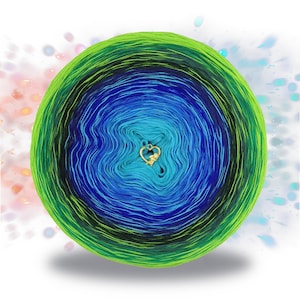 May include: A skein of yarn with a gradient of green, blue, and black colors. The yarn is wound into a circle and has a small gold heart charm in the center.