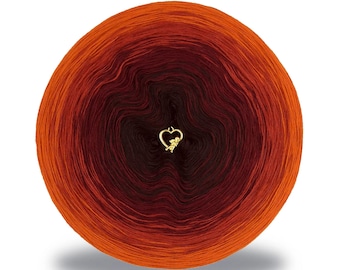 May include: A skein of yarn in a gradient of orange, red, and brown colors. The yarn is wound into a circle and has a small gold heart charm in the center.
