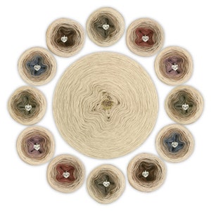 May include: A collection of 12 skeins of yarn in various shades of beige, brown, pink, and blue. Each skein has a small silver charm in the shape of a heart.