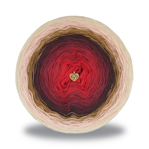May include: A ball of yarn with a gradient of colors, transitioning from light beige to deep red. A gold-colored heart-shaped charm is attached to the center. The yarn is likely for knitting or crochet projects.