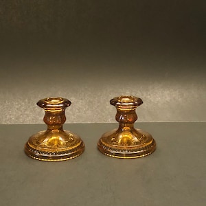 Vntg pair indiana amber glass candlesticks