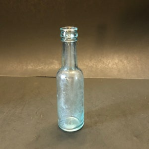 Antique Aqua blue soda bottle