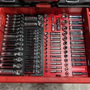 May include: A red toolbox with a black and red organizer tray filled with various sizes of chrome socket wrenches.