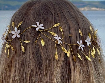 Gold bridal hair vine with white flowers and golden leaves