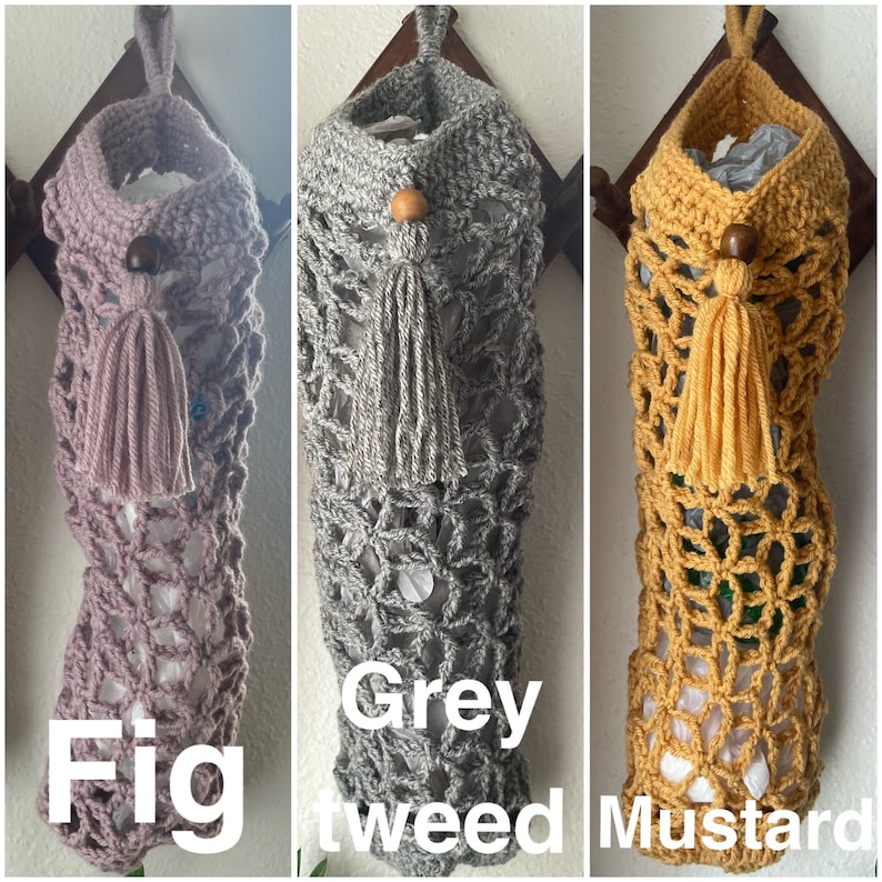 May include: Three crocheted bags with wooden beads and tassels hanging from hooks. The bags are in fig, grey tweed, and mustard colors.