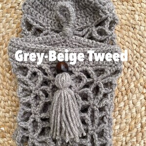 May include: Grey-Beige Tweed crocheted bag with a tassel and wooden bead.