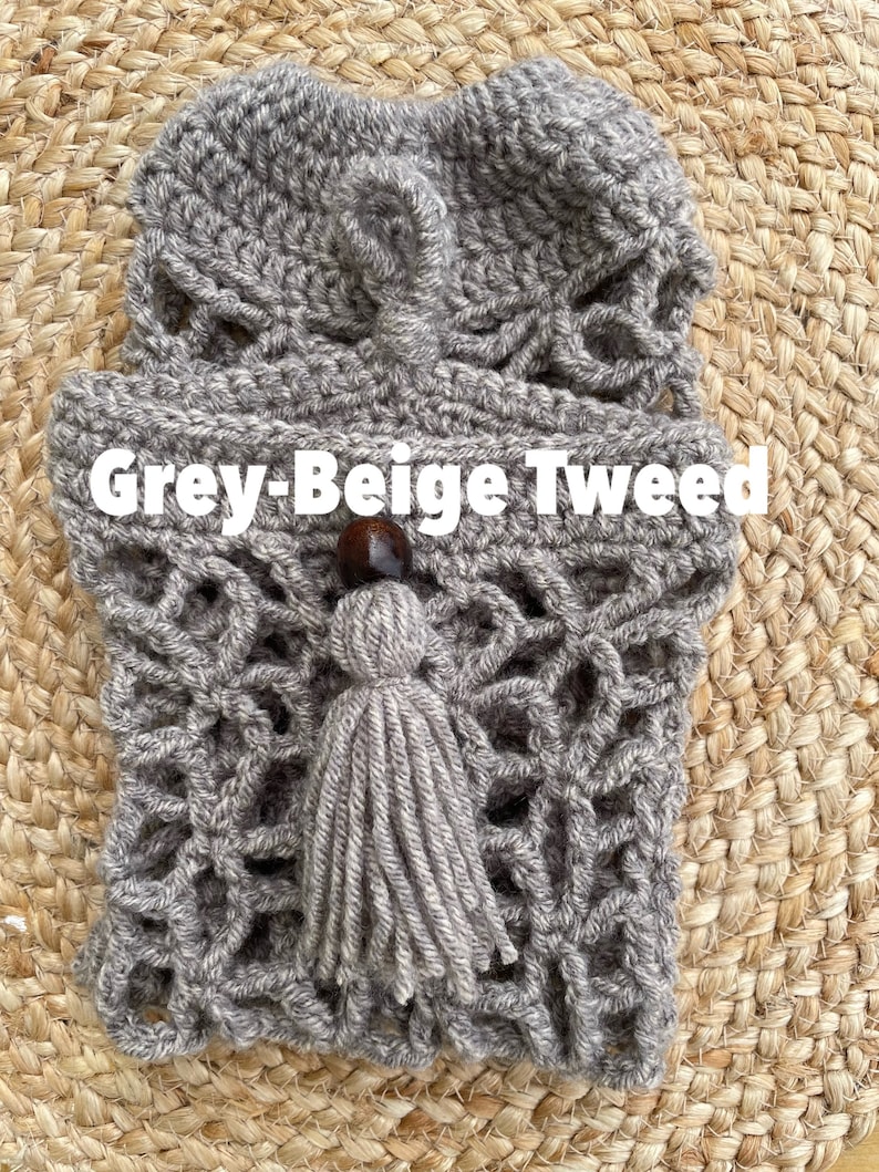 May include: Grey-Beige Tweed crocheted bag with a tassel and wooden bead.