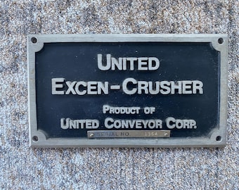 Vintage Cast Aluminum Sign United Exen-Crusher