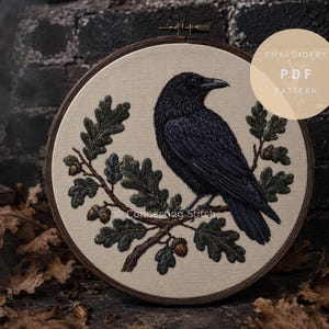 May include: A circular embroidery piece showing a black raven on an oak branch with acorns, set against cream fabric. The design is in a wooden hoop, with the text "EMBROIDERY PDF PATTERN" in a circle. The overall aesthetic is rustic and detailed.